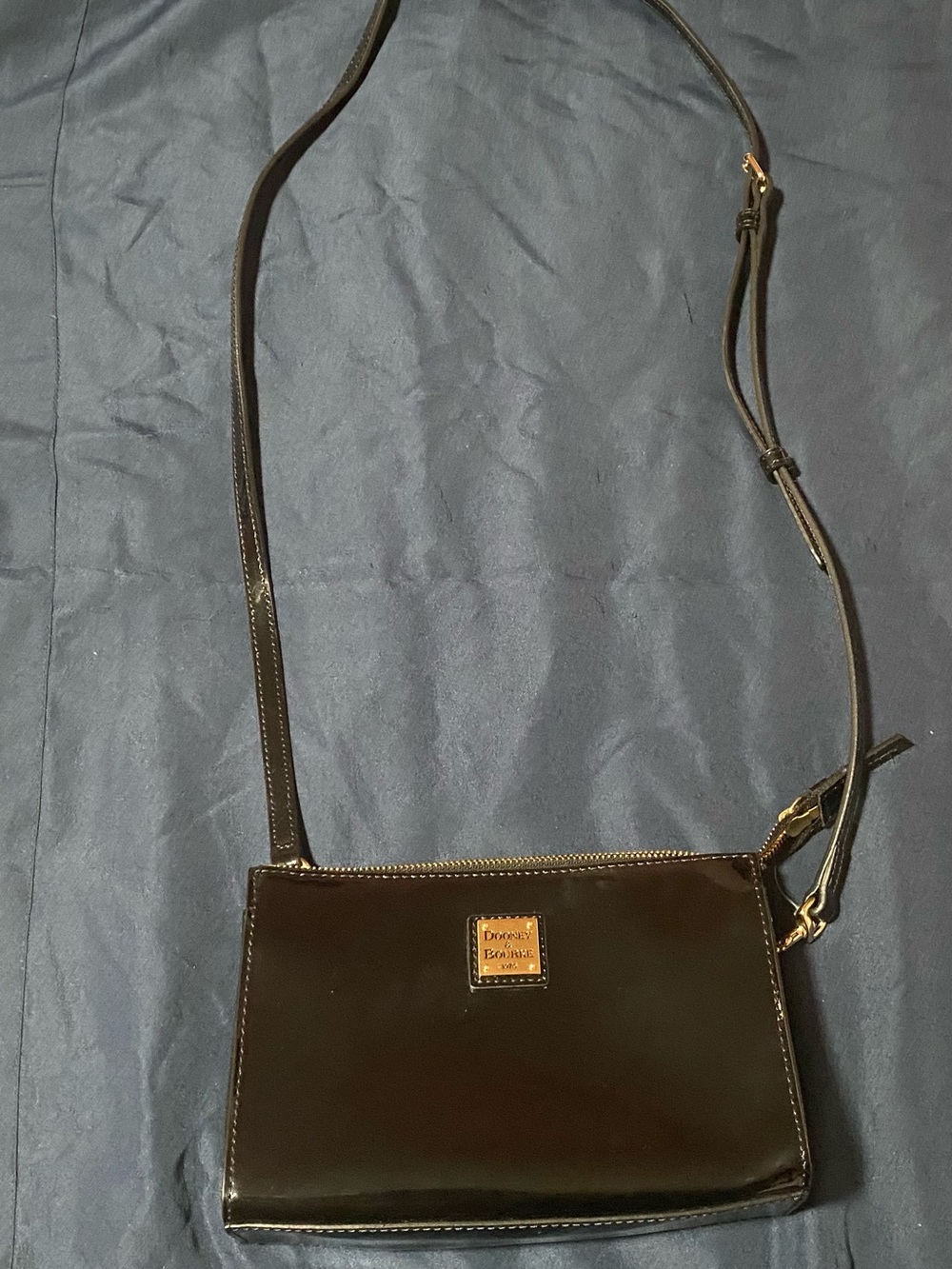 Dooney & Bourke Black Patent Leather Crossbody with Gold Logo Plaque